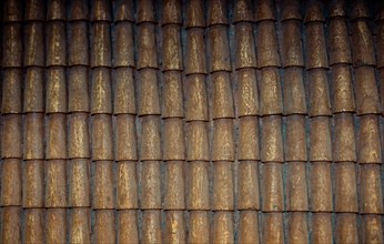 Traditional roof covered with brown tiles made of wood