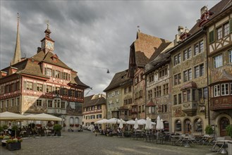 Town hall and medieval half-timbered houses with facade paintings on Rathausplatz in the old town