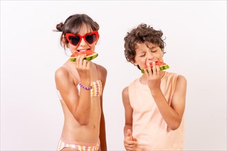 Children enjoying the summer with eating a watermelon