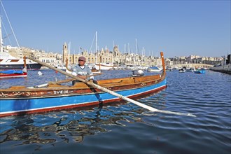 Traditional boat or dghajsa in Grand Harbour