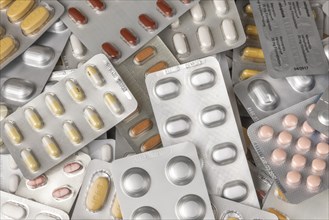 Colourful pills and capsules in blister packs