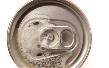 Top view of an out-of-focus beer can on a white background