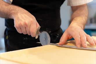 Detail of a man's hands baking homemade croissants
