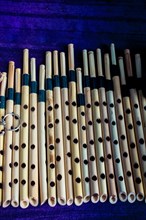 Dozens of handmade bamboo fluteson on sale in display
