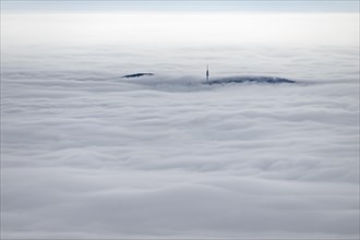 Sea of clouds with transmission mast