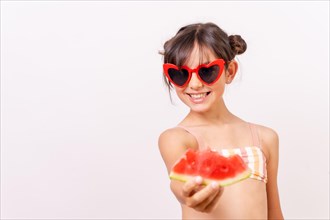 Girl enjoying the summer eating a watermelon