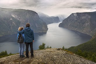 Father and daughter on Mount Prest looking over the Aurlandsfjord in Norway