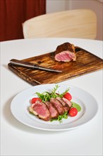 Juicy grilled duck breast served on a plate