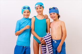 Portrait of children dressed in swimsuits for swimming lessons in the pool. White background