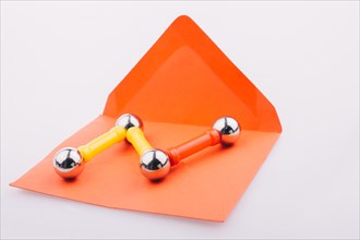 Magnet toy bars and magnetic balls on red envelope
