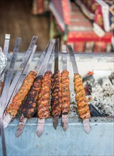 Turkish Adana/Urfa Kebab getting ready to be grilled in display