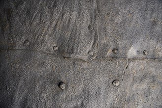Old forged metal plates as background or texture