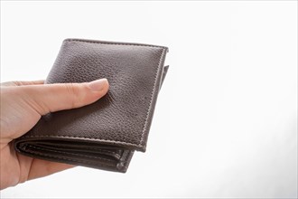Brown leather wallet in hand saving and finance concept