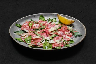 Marbled beef carpaccio with arugula and chard leaves