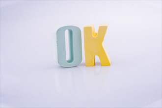 The word OK written with colorful letter blocks