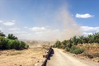 Cloud tornado on the edge of a roadway in southern Morocco. Agdz