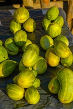 Green cucumbers for sale at a market