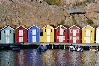 Colourful boathouses and storage sheds in the harbour of the fishing village