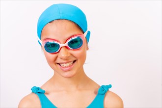 Portrait of girl with swimsuit and diving goggles for swimming lessons in the pool in summer. White background