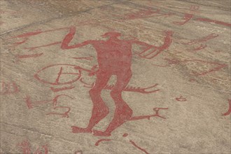 Rock carvings with figures