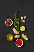 Composition with condiments on black background. All purpose spice
