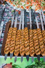 Turkish Adana/Urfa Kebab getting ready to be grilled in display