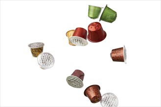 Different coloured used coffee capsules