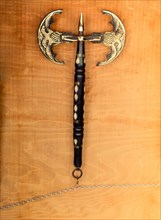 War axe and mace on a wooden background