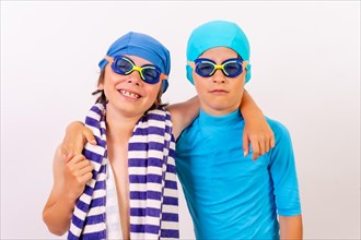 Siblings dressed and hugging in their swimsuits for swimming lessons in the pool. White background