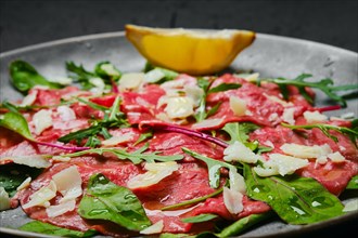 Marbled beef carpaccio with arugula and chard leaves