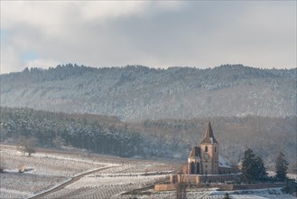 Saint-Jacques-le-Majeur mixed church under the snow near the wine route. Hunawihr