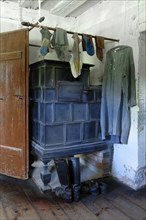 Laundry by the tiled stove in the parlour