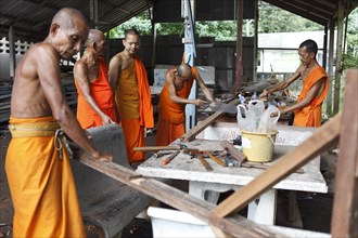 Monks working with wood