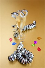 Champagne glass with streamer and confetti