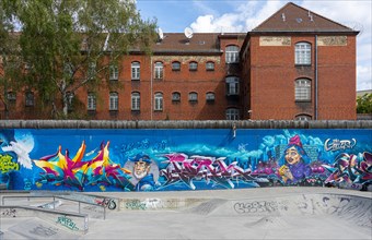 Colourful graffiti on the wall of the woman's prison in Berlin Moabit