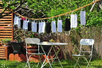 Self-sewn mouth-nose protection masks drying on a clothesline