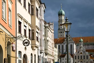 Row of houses in Maximilianstrasse in Augsburg with the Basilica of Saint Ulrich