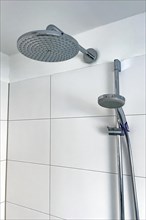 Shower with two shower heads left large shower head type rain shower with high water consumption