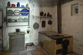 Kitchen with plate rack and cooker 1926