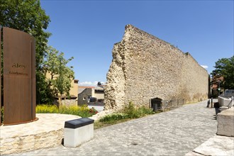 Remains of the medieval city wall and reminder of an earlier bell tower