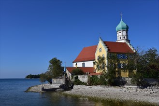 St. Georges Catholic Parish Church in moated castle am Lake Constance