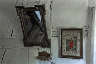 Image of a saint and mirror in the living room of the shepherds house
