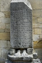 Memorial stone of various popes at the portal of the pilgrimage church
