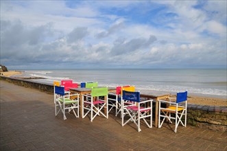 Chairs on the waterfront in Saint-Aubin-sur-Mer in the department of Calvados