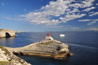 The lighthouse Phare de la Madonette at the harbour entrance of Bonifacio