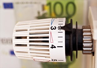Thermostat in front of euro note