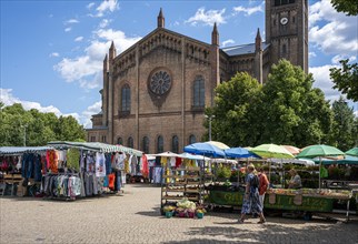 Market stall in front of the church of Saint Peter and Paul