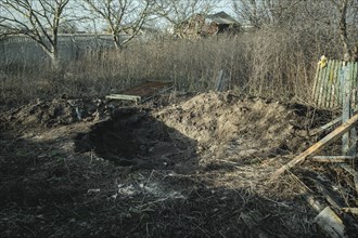 Human remains at a grave where the bodies of six civilians from Praviden were temporarily given a makeshift burial after being tortured and then executed by Russian soldiers