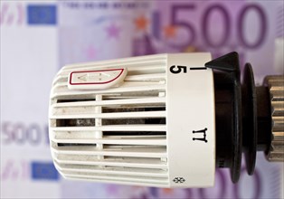 Thermostat in front of five hundred euro note