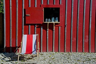 Deck chair in front of a restaurant in an allotment garden colony